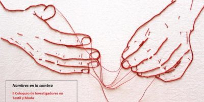 embroidery of two hands with loose threads strung between them