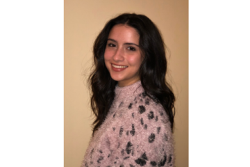 Student smiling at camera for a headshot.