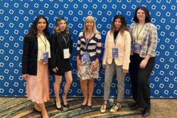 Four student winners and faculty member