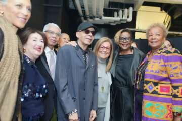 a group of fashion industry people stand with Stephen Burrows