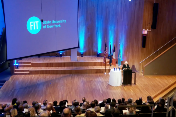 Yasemin Jones on the stage of Katie Murphy Amphitheatre at Fall 2024 convocation.